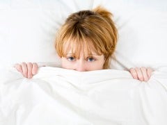 Woman under the covers