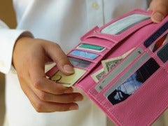 Woman's hand opening a wallet